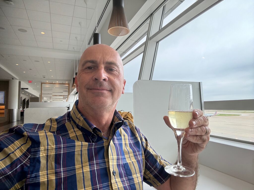 a man holding a glass of wine