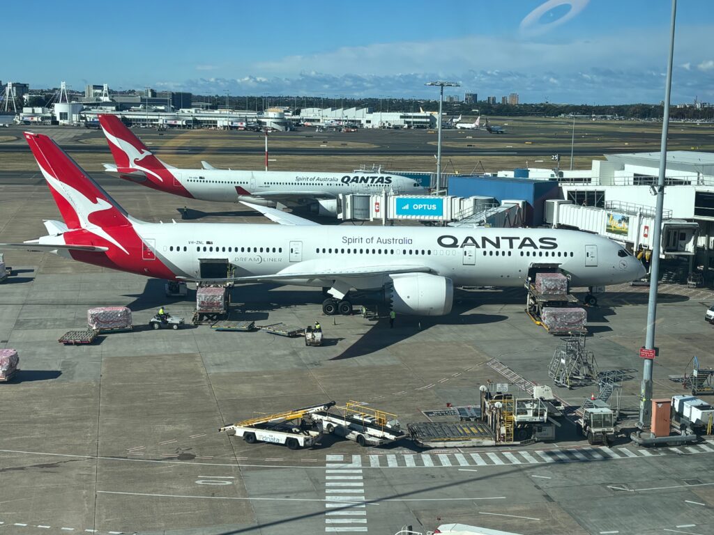 a group of airplanes at an airport