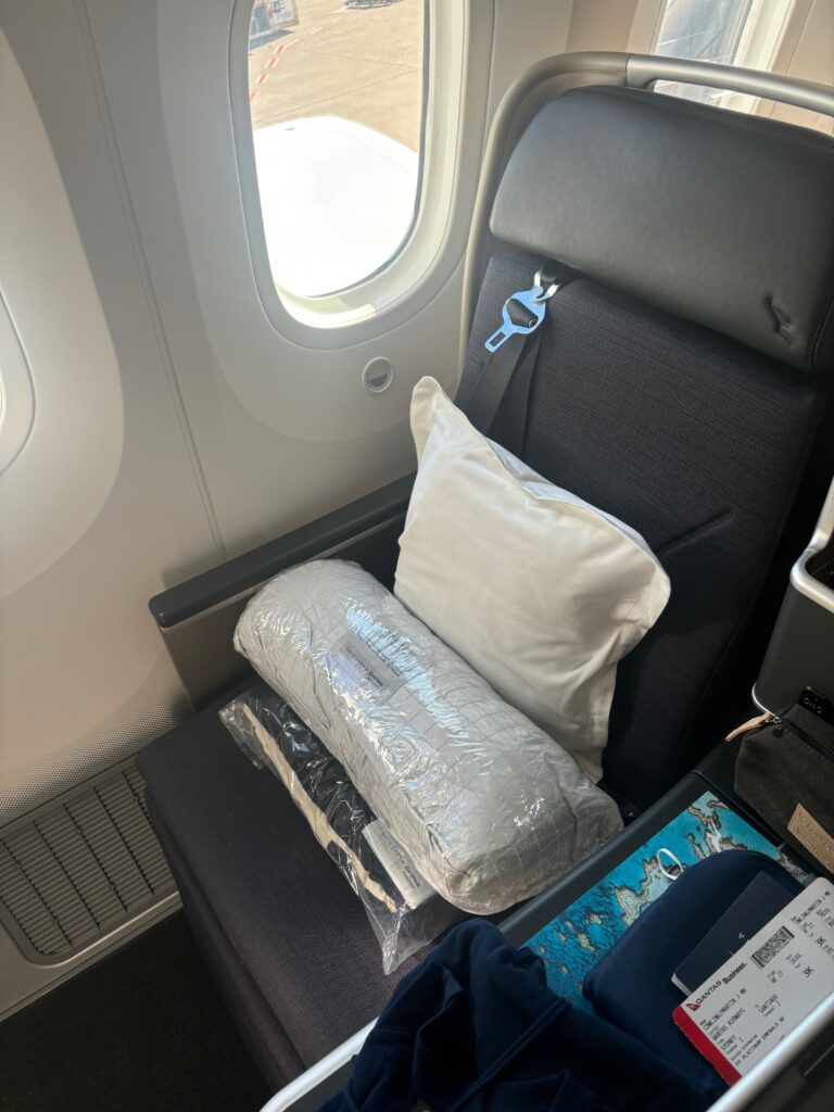 a seat with pillows and a pillow on it