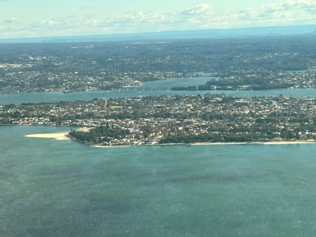 an aerial view of a city and water