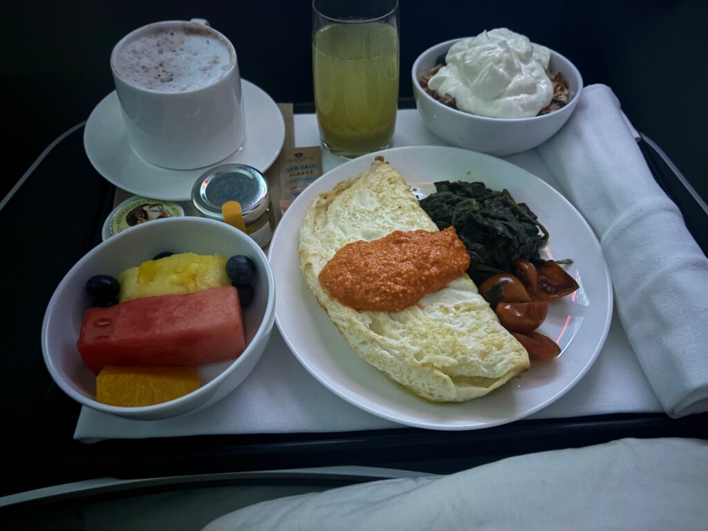 a plate of food and drinks on a tray