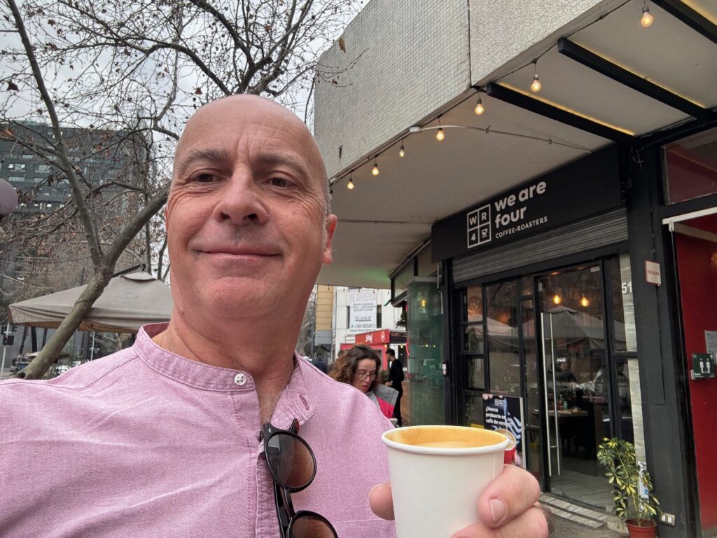 a man holding a cup of coffee