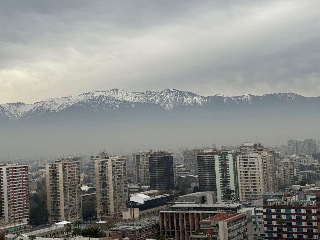 a city with mountains in the background