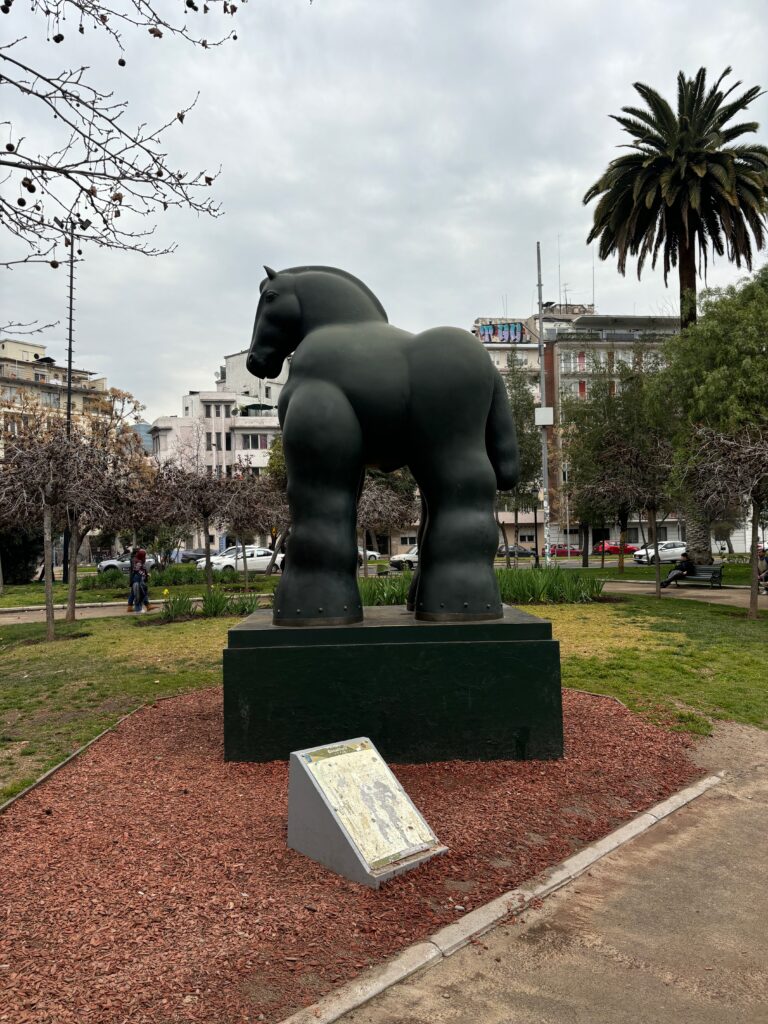 a statue of a horse in a park