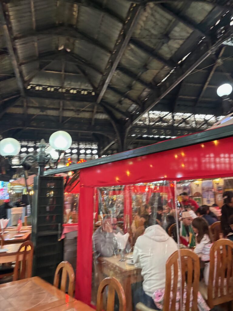 a group of people sitting at tables in a restaurant