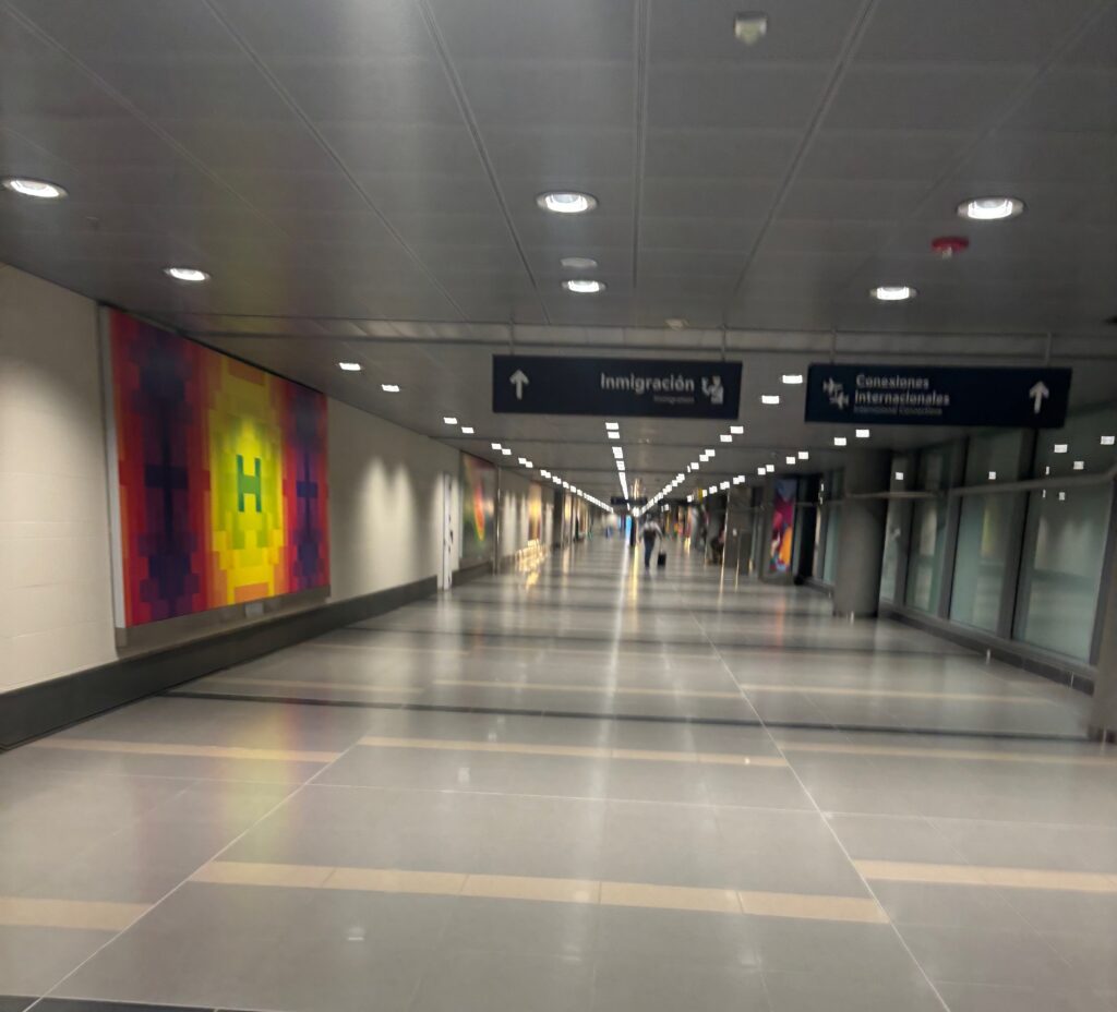 a long hallway with a sign on the wall