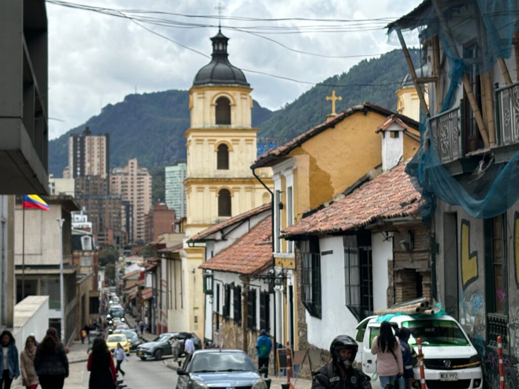 a street with cars and people on it