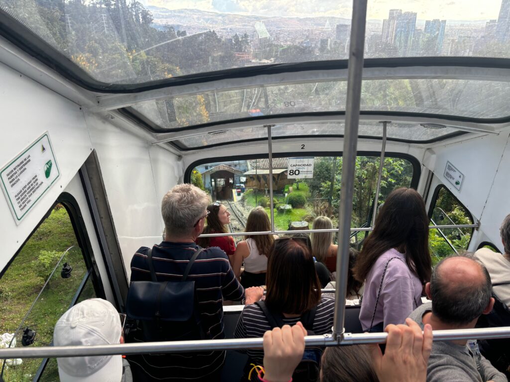 a group of people on a cable car