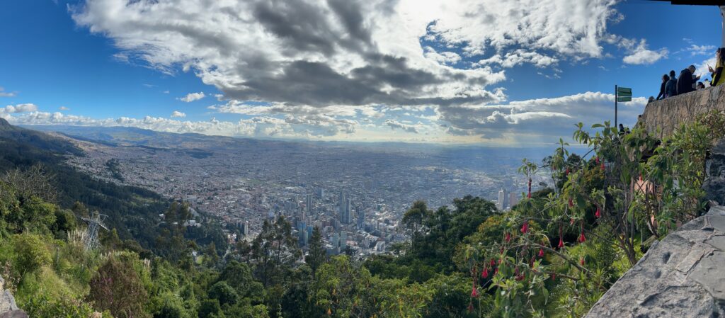 a city landscape with trees and clouds