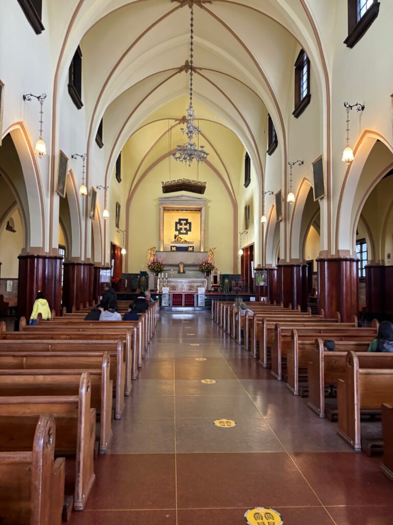 a church with pews and a cross