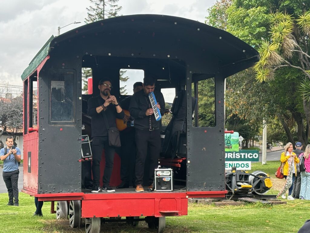 a group of men playing instruments in a train car