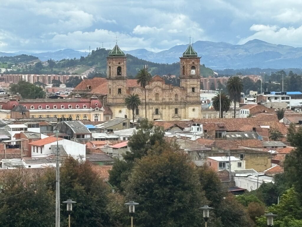 a city with a church and trees