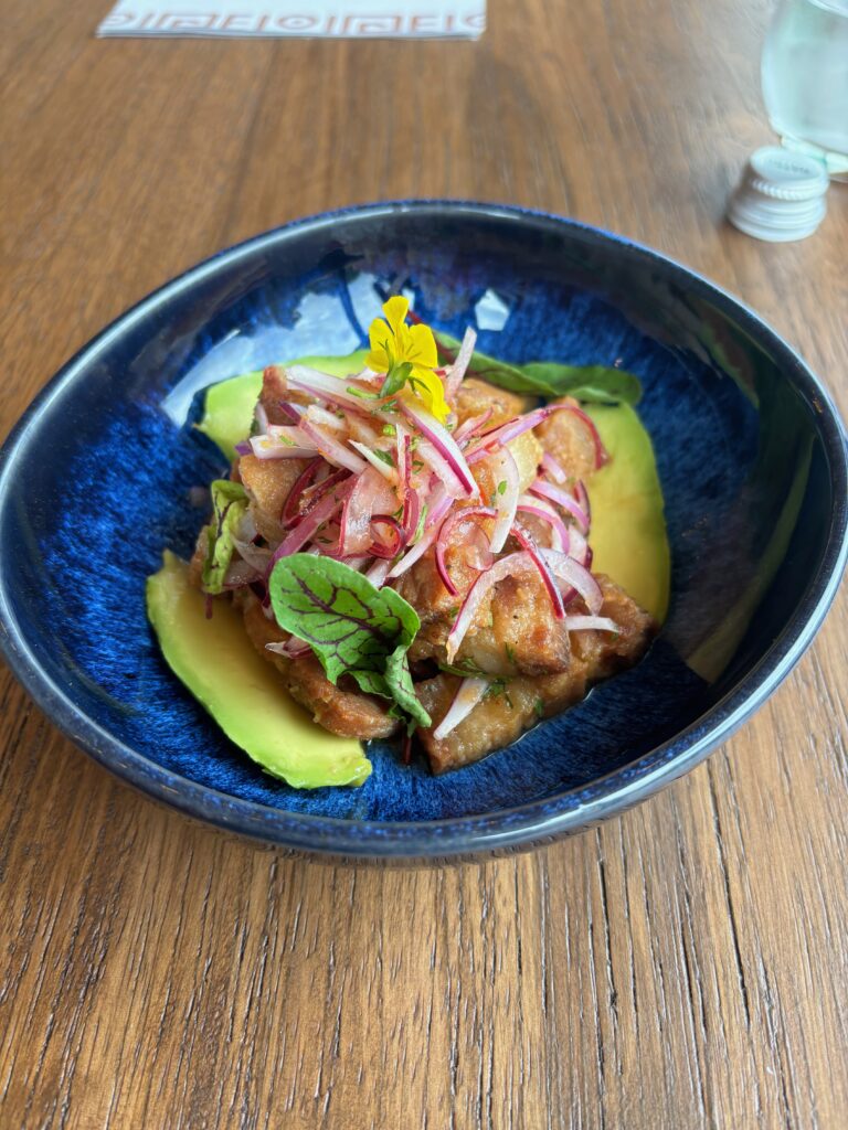 a blue bowl with food on it