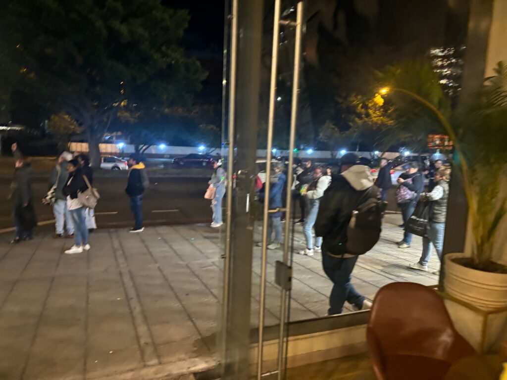 a group of people standing outside a building