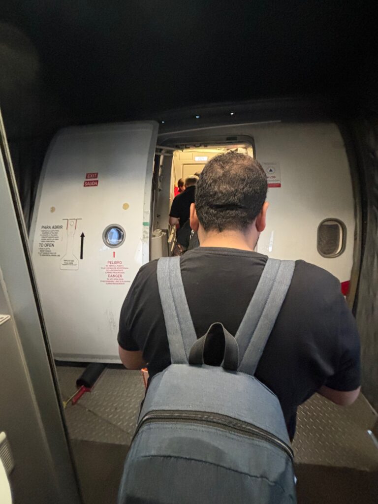 a man walking through an airplane