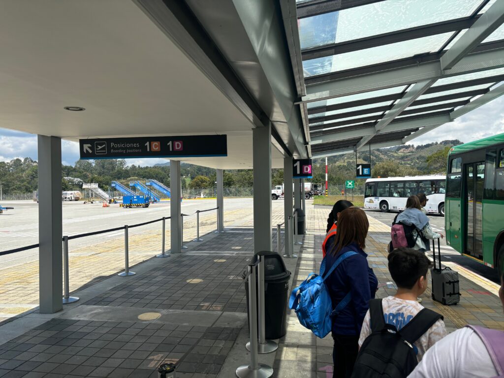 people standing in a bus stop