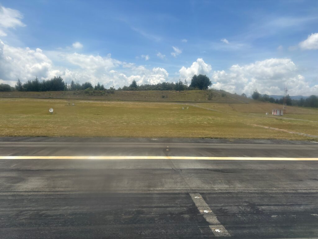 a road with a hill in the background