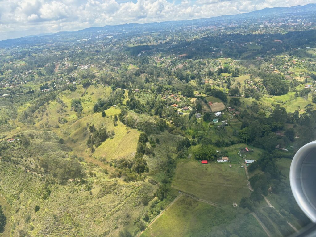 an aerial view of a green landscape