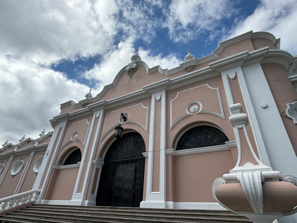 a building with a staircase and a blue sky