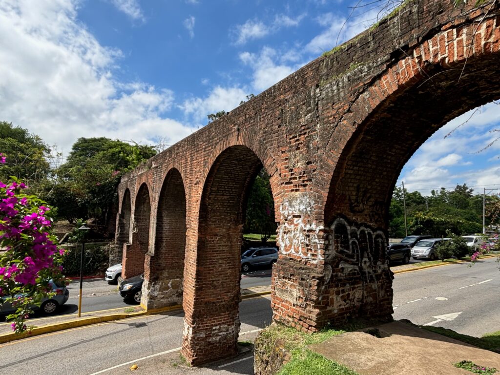 a brick bridge with arches