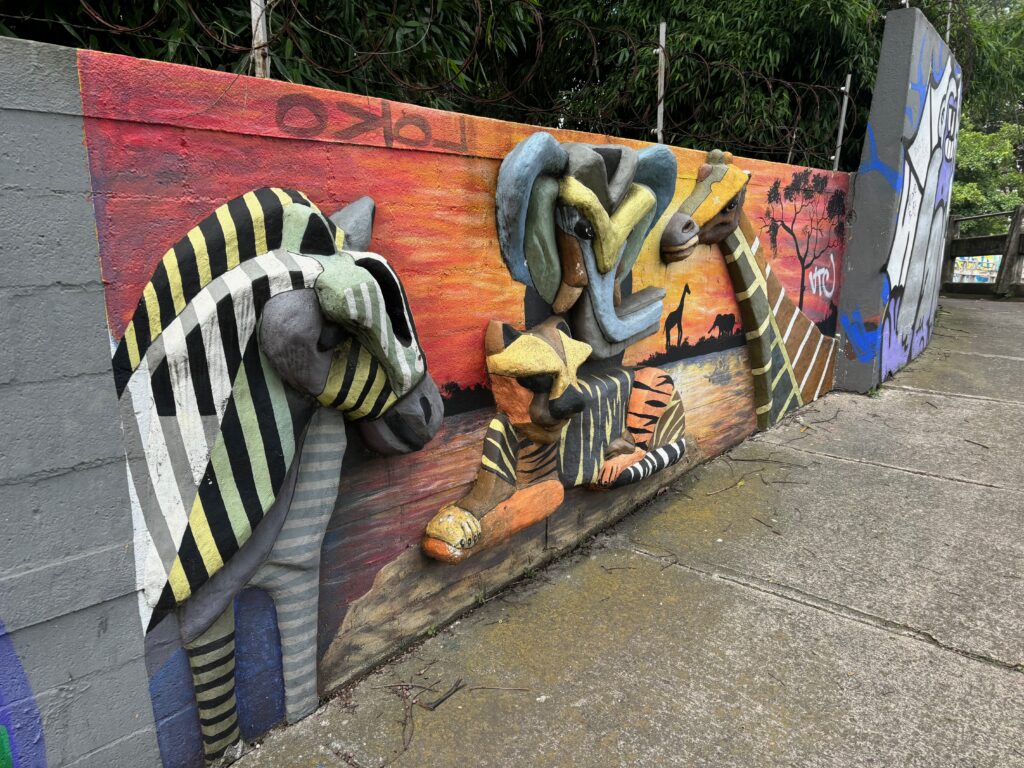 a wall with zebras painted on it