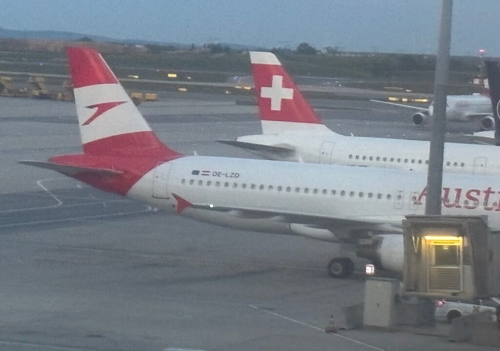 a group of airplanes at an airport