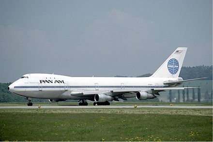 a large white airplane on a runway