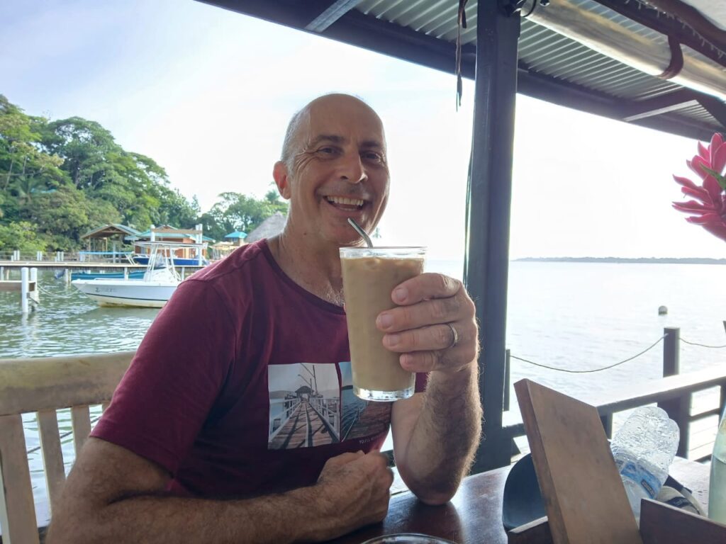 a man holding a straw in his hand