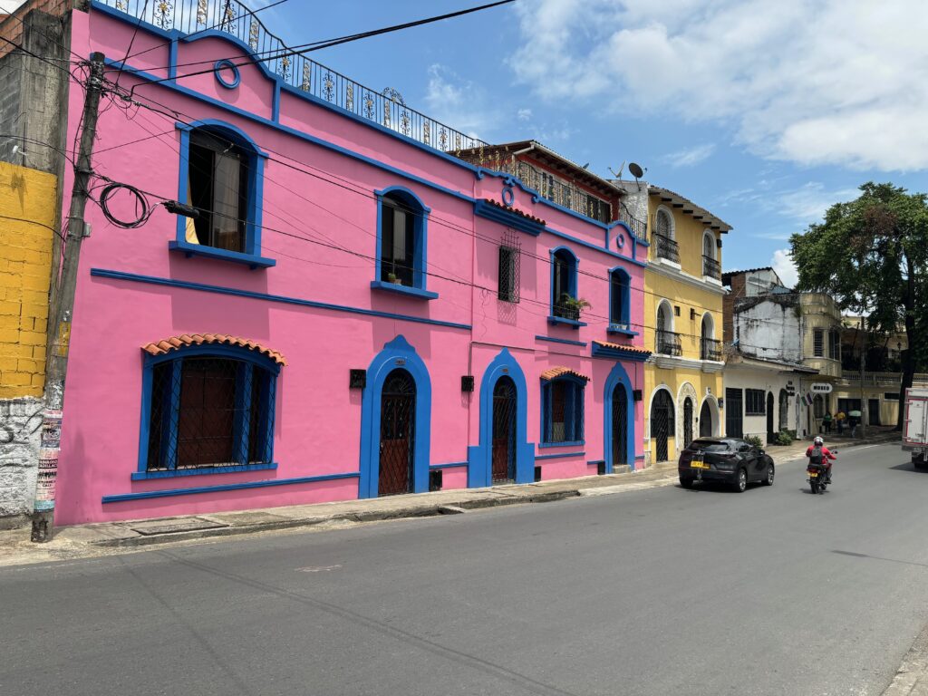 a pink building with blue trim