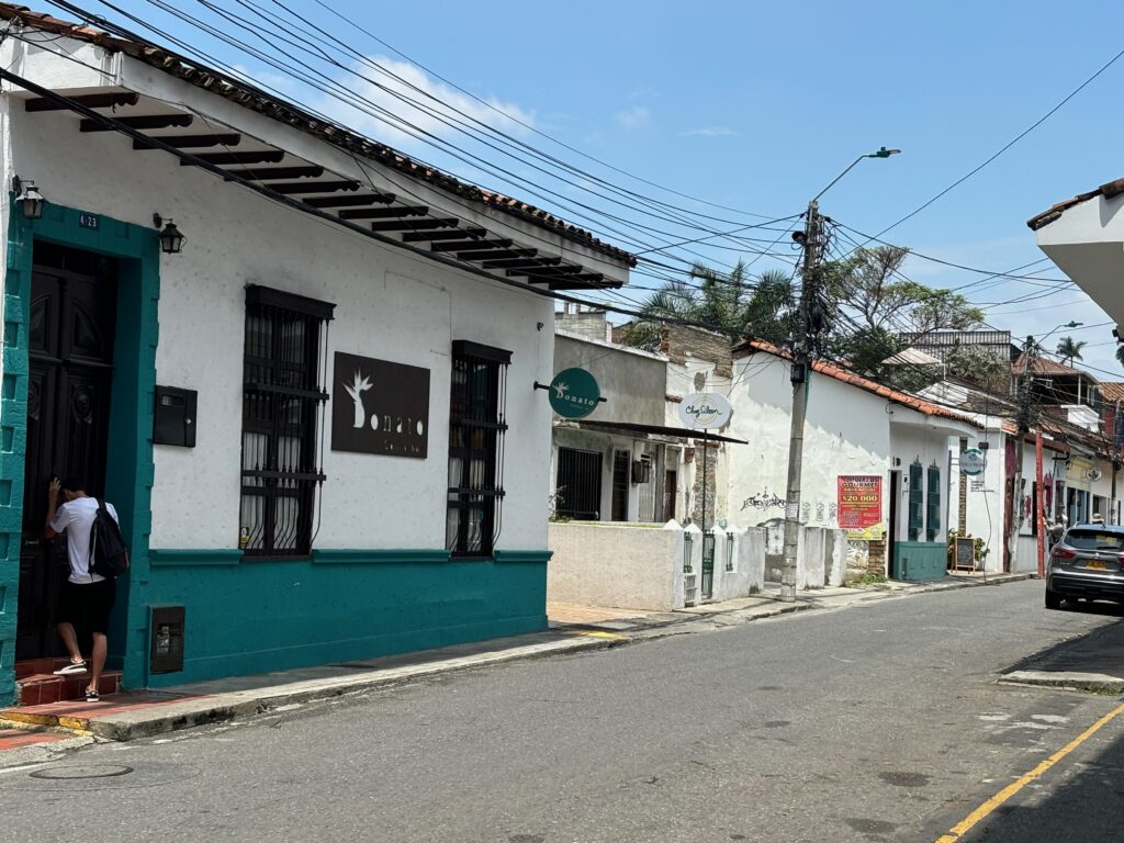 a street with buildings and power lines