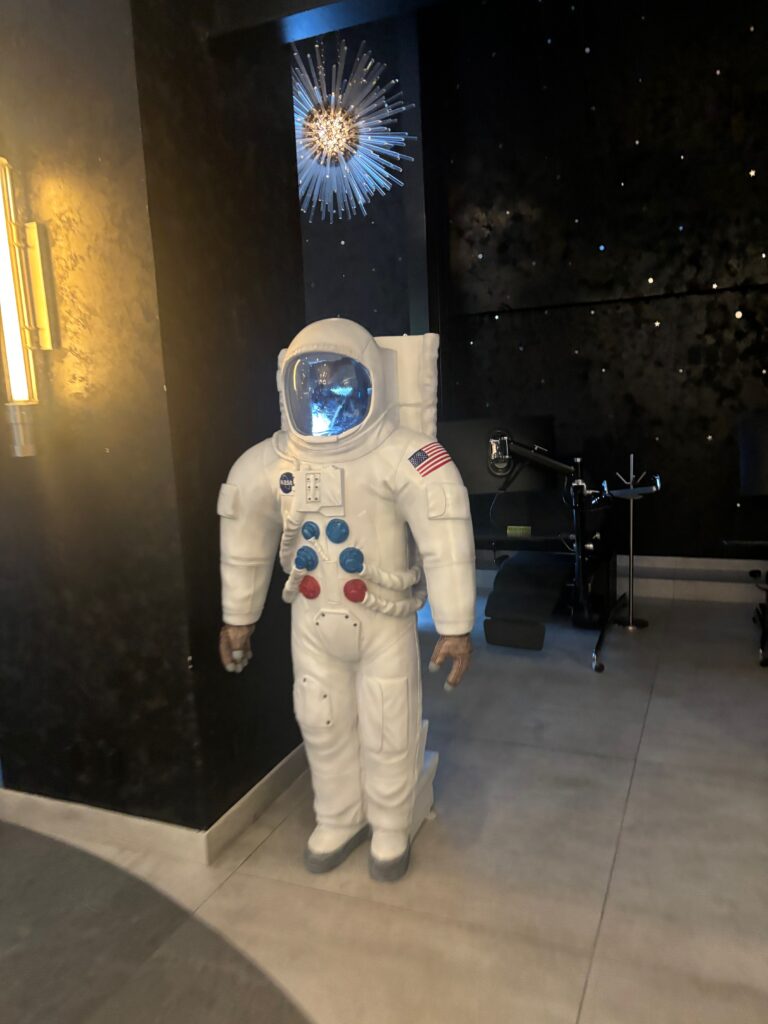 a white astronaut suit in a room