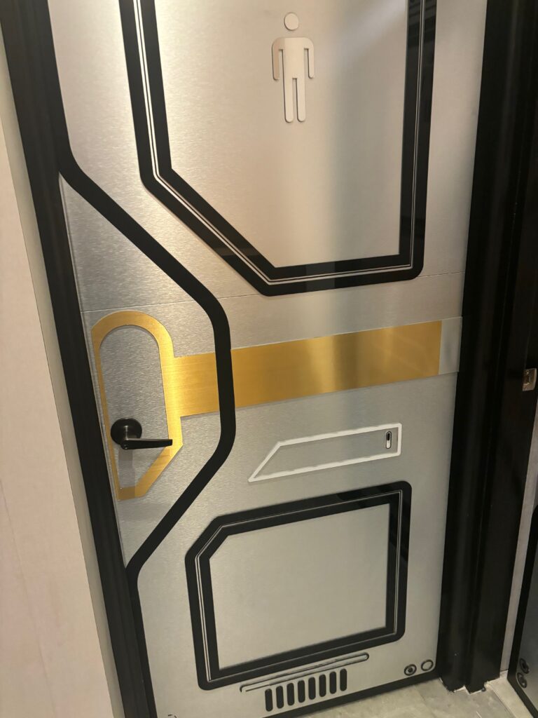 a door with black and gold trim