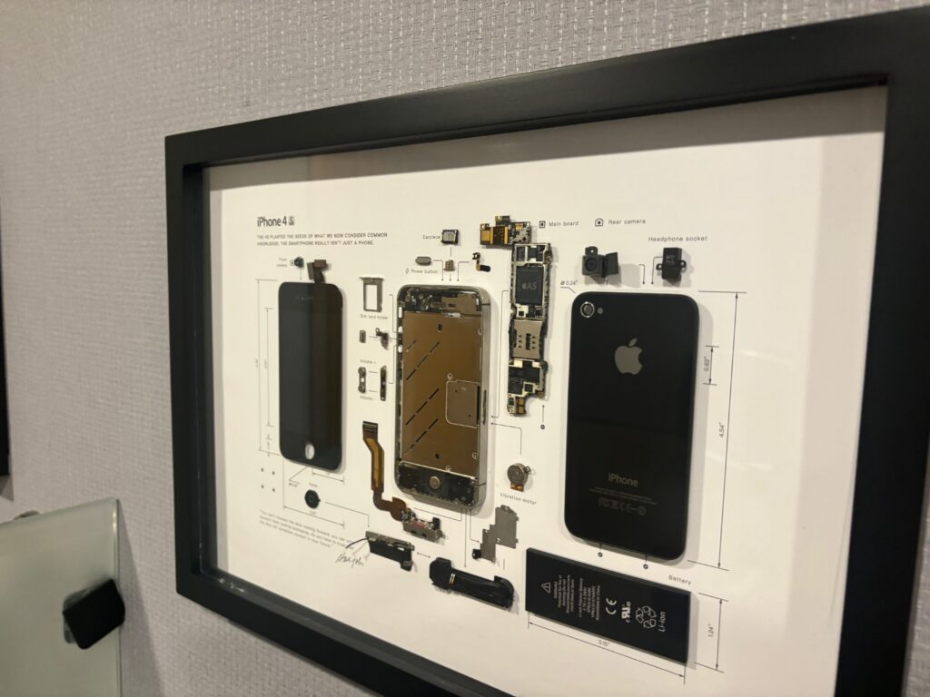 a frame with parts of a cell phone