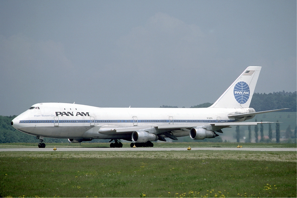 a large white airplane on a runway