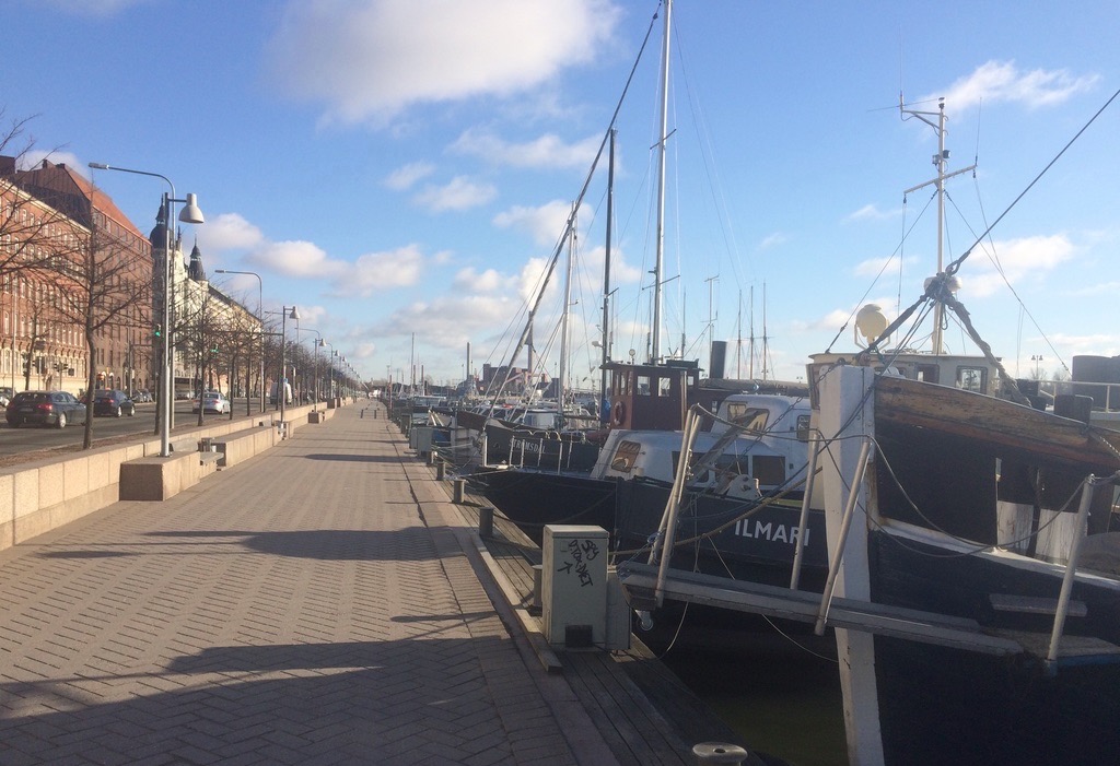 a row of boats on a dock