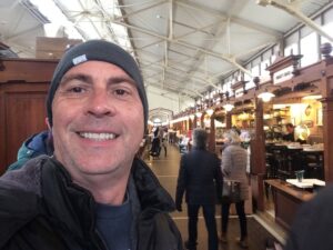a man taking a selfie in a restaurant