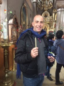 a man holding a candle