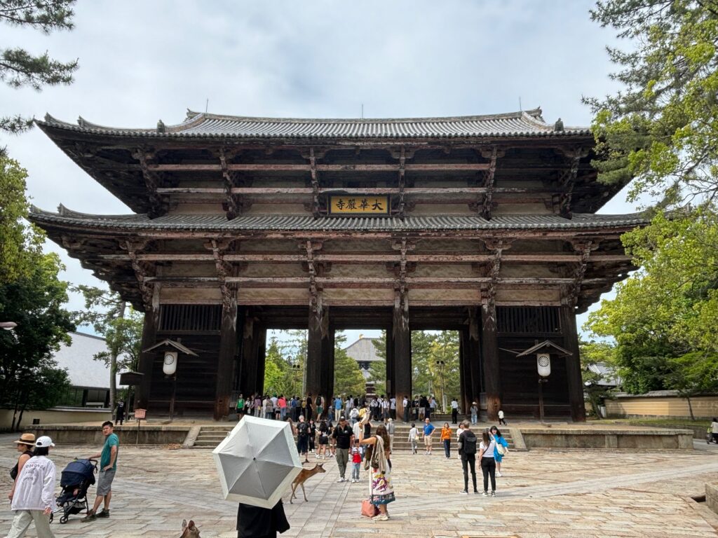 a large building with people walking around