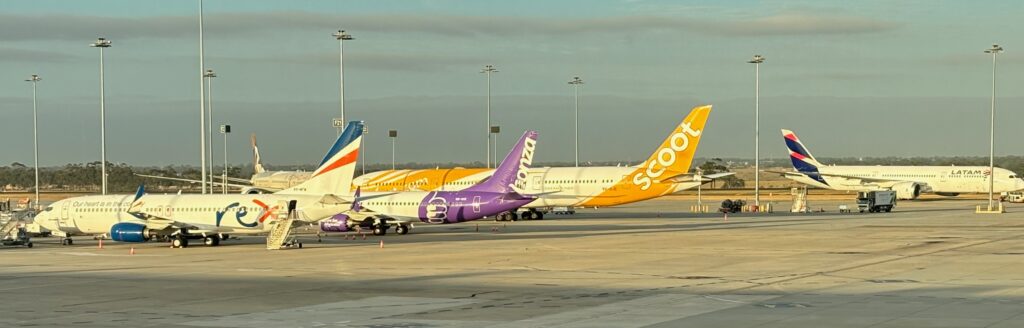 airplanes parked on a runway