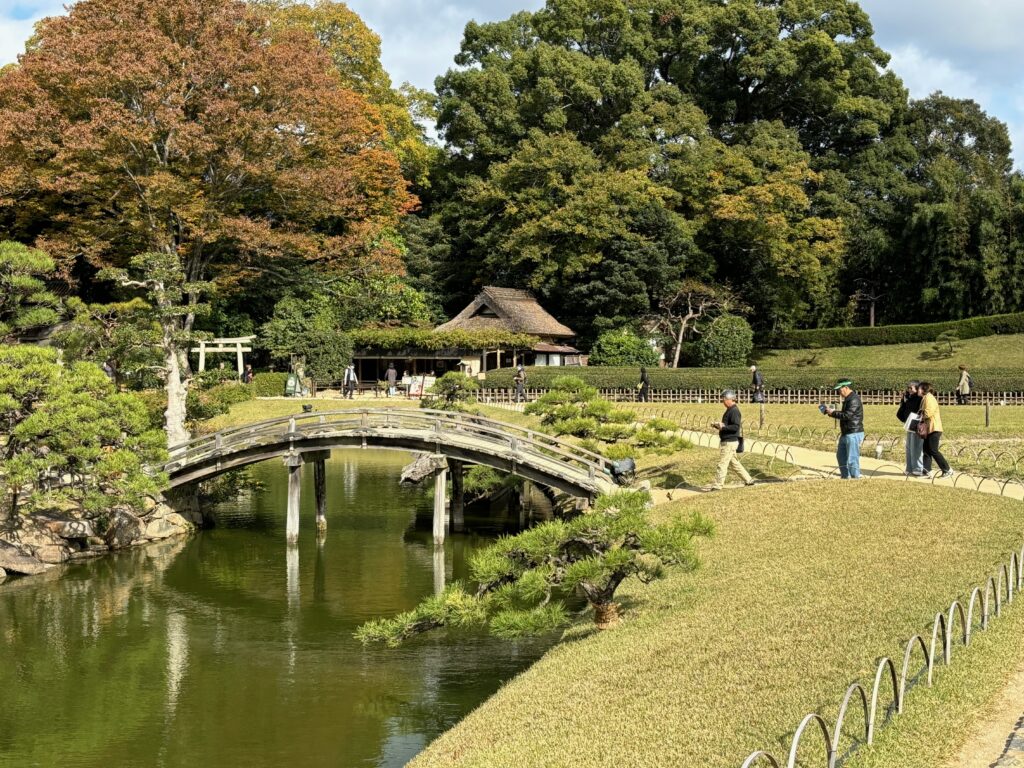 a bridge over a river with people walking on it