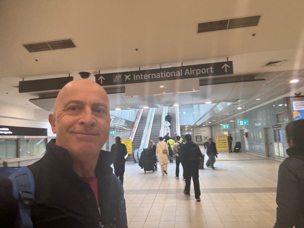 a man taking a selfie in a airport