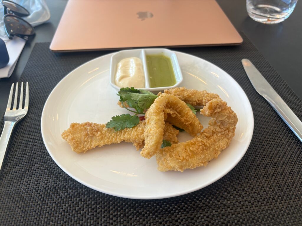 a plate of fried food with sauce on it