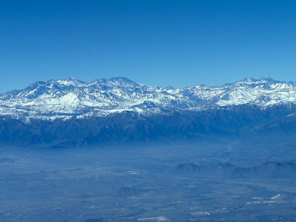 a snowy mountain range and blue sky