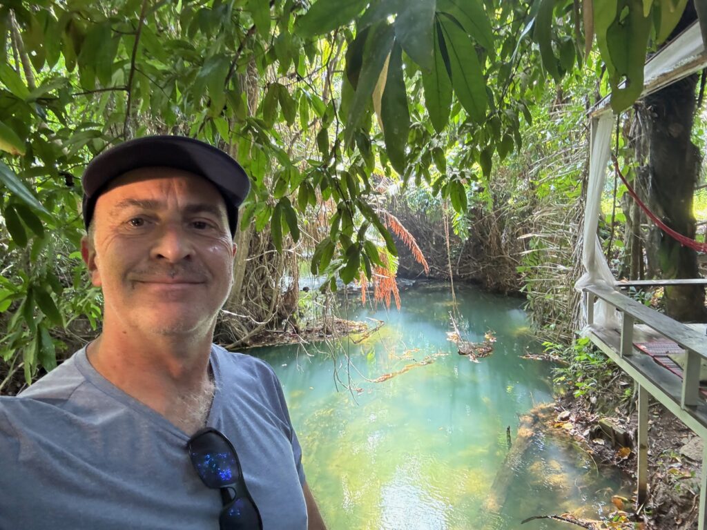 a man taking a selfie in a forest