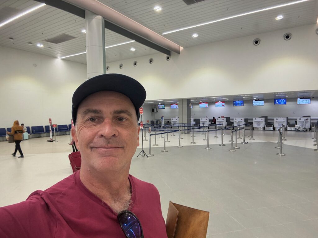 a man taking a selfie in an airport