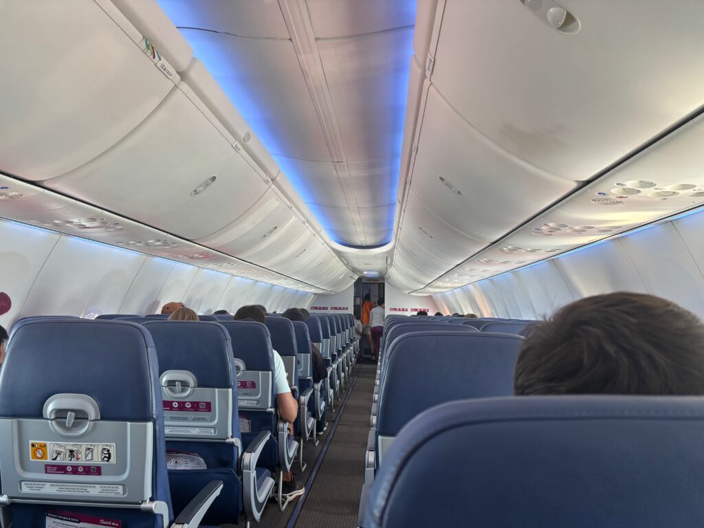 a plane with people sitting in the seats