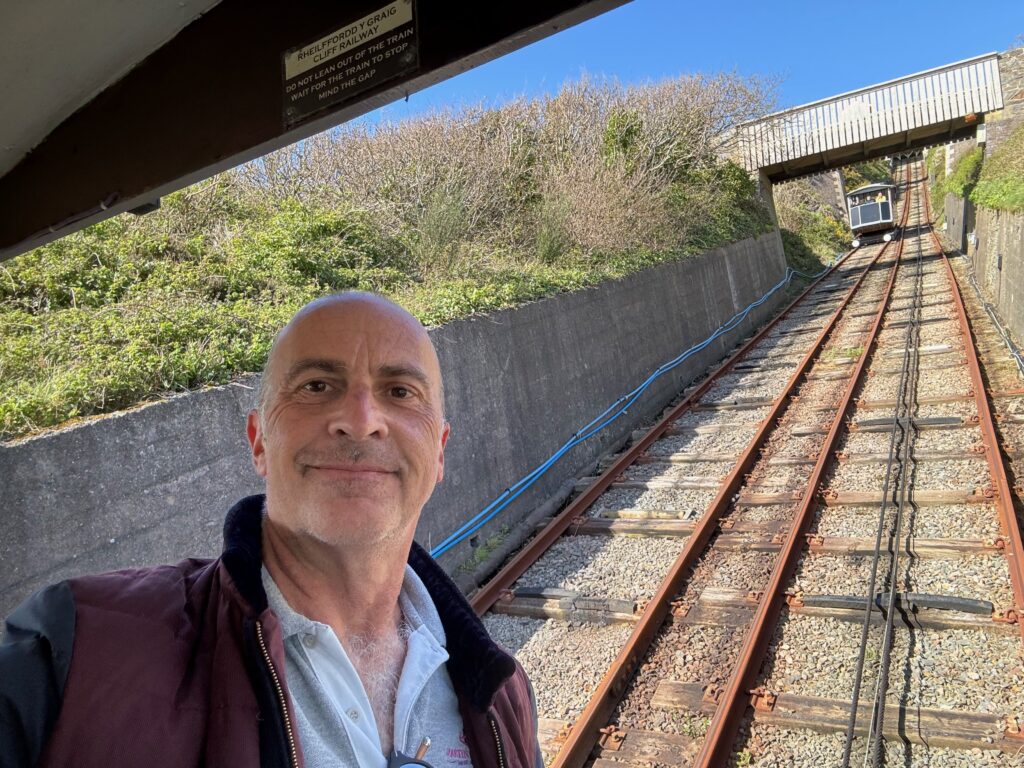 a man taking a selfie on a train track