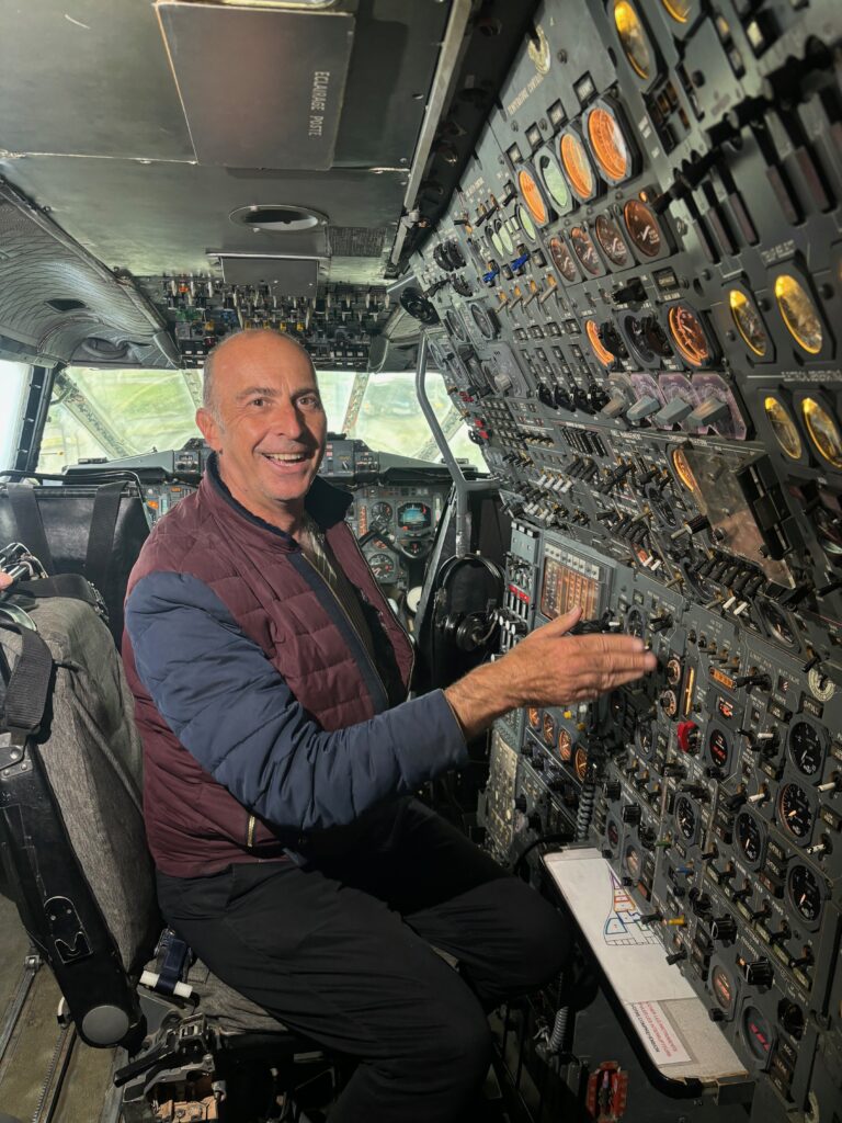 a man sitting in a cockpit