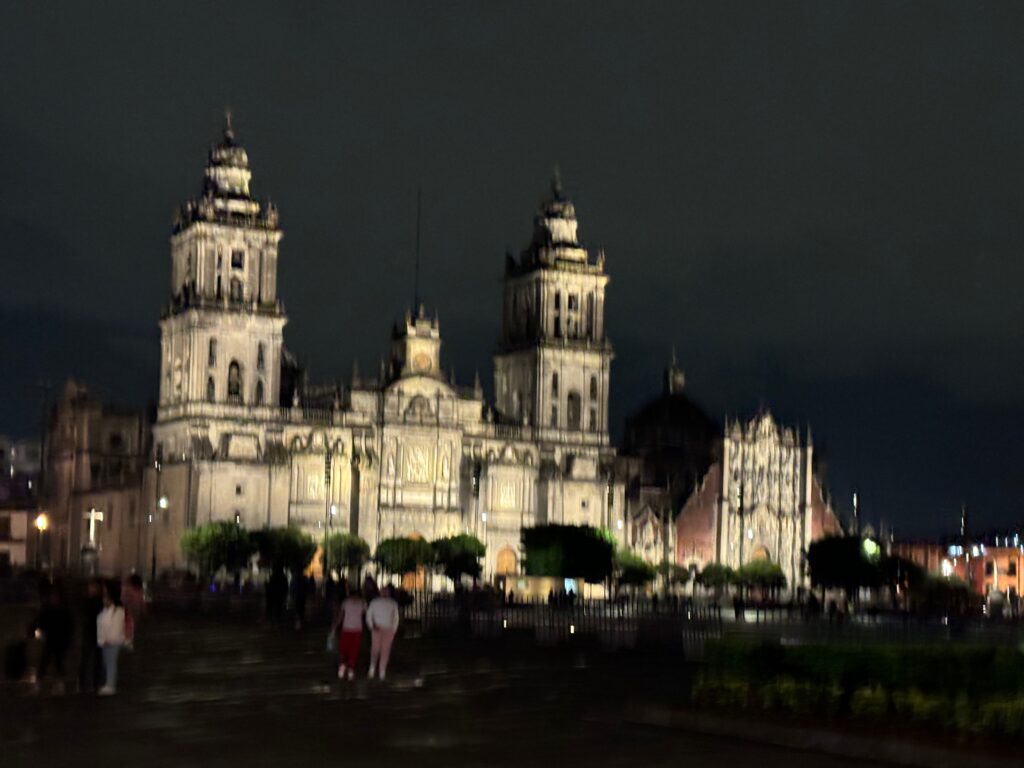 a large building with towers at night