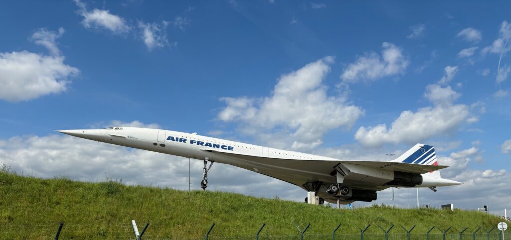 a large airplane on a grassy field